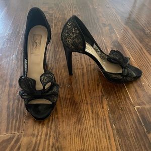 Gently used lace black and satin Valentino peep toe heels
